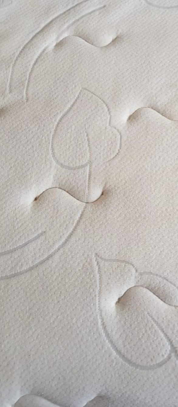 The same mattress after RugMaster deep extraction and allergen treatment